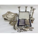 A set of four EP candlesticks, entree dish and caver, flatware etc, grape scisssors, open salt.