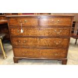 A George III oak chest of drawers, fitted with two short over three long graduated drawers,