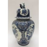A Delfts blue and white temple jar and cover, having crude Dog Of Foe to the finail,