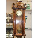 A late nineteenth Century, walnut, eight day Vienna wall clock, spring driven movement,