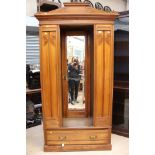 An Edwardian satinwood three piece bedroom suite, comprising single door wardrobe with drawer below,