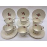 A set of six Spode coffee cups and saucers lace doily,