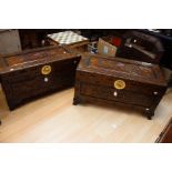 A pair of Chinese carved hardwood camphor chests,