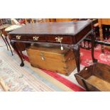 A Chippendale style mahogany three drawer side table