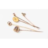 Five Victorian/Edwardian yellow metal semi precious stone set stick pins,