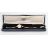 A lady's vintage Audax nine carat gold watch on nine carat gold bracelet