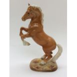 A Palomino rearing horse by Beswick,