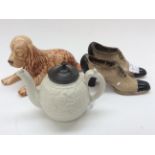 A small 1840s salt glaze teapot, two circa 1900 ceramic ladies shoes,