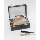 Silver retractable comb tortoise shell effect comb, London 2003 modern,