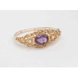 A 9ct gold openwork amethyst and pearl set bracelet,