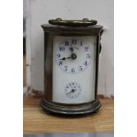 A miniature 'All Round' brass clock, enamelled dial, cracked, Arabic numerals seconds hand,