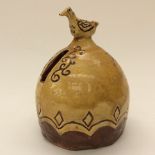 18th Century terracotta money bank, having cockeral finial incised in brown 'May Ye Prosper 1765'.