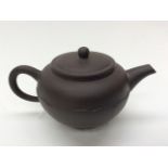 Brown oriental terracotta tea pot,