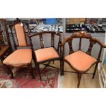A pair of Edwardian mahogany and inlaid corner chairs, and a Victorian rosewood side chair,