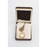 A Marvin pendant watch, nine carat gold square frame, gold tone dial with a figaro chain,