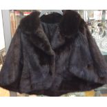 A dark mink shoulder cape,