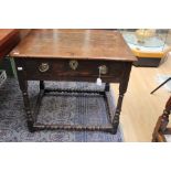 A late 17th Century oak side table, joined construction, fitted with a single drawer,