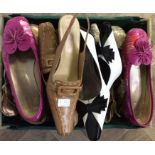 A collection of shoes to include tan leather sling backs, gold stilettos with open side,