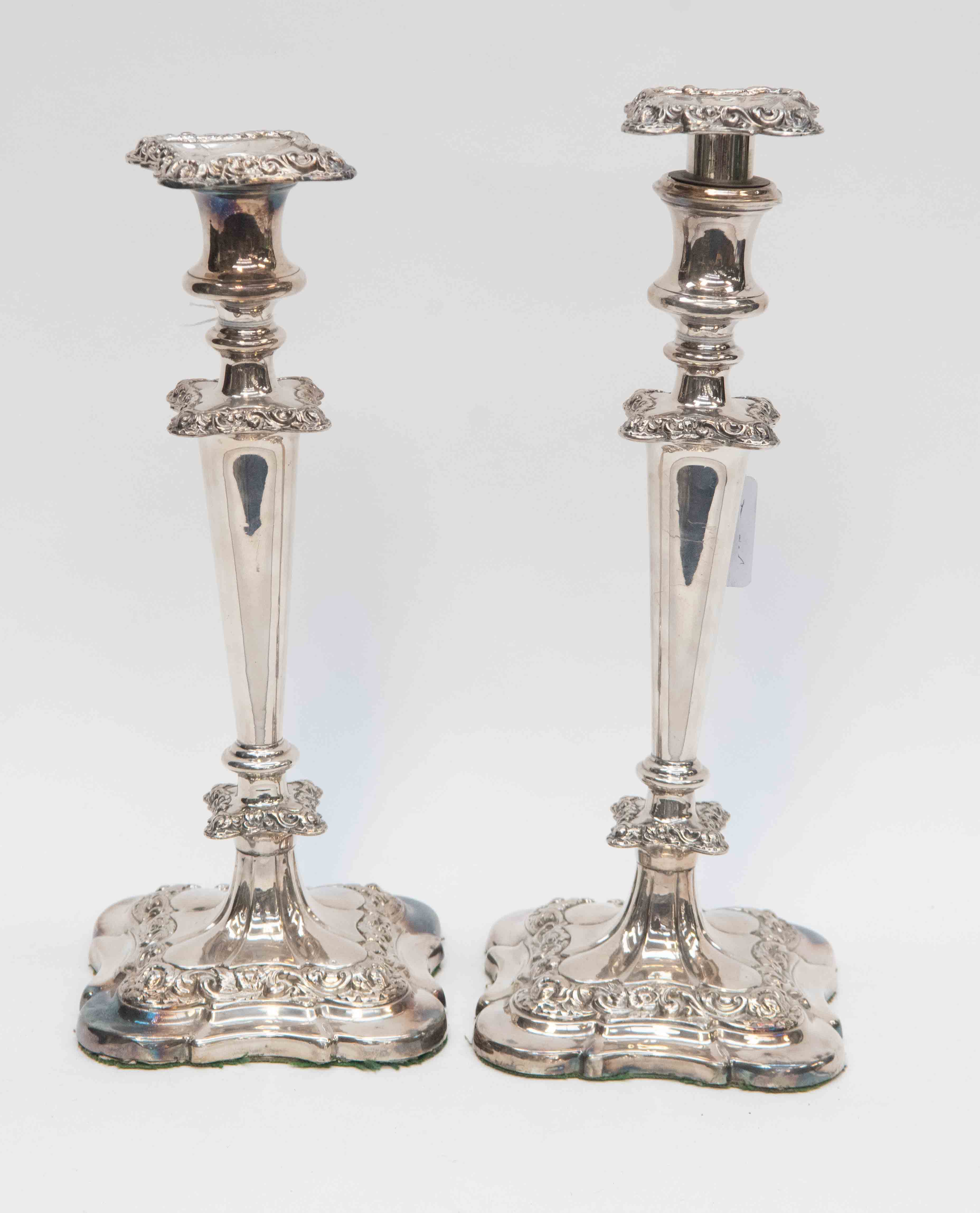 A pair of Georgian silver plated candlesticks,