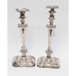 A pair of Georgian silver plated candlesticks,