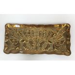 An Arts and Crafts repousse brass rectangular tray