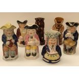 Seven circa early 20th Century Toby jugs, including two drip glaze, one with original hat,