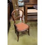 A Victorian mahogany balloon back child's chair.