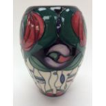 A Moorcroft boxed vase, 'Bella Houston' pattern, initialled to the base 'W.M.