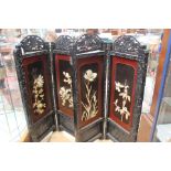 A pair of Oriental lacquered folding screens,