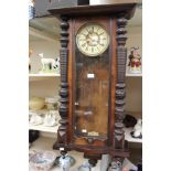 A German wall clock, mahogany frame with turned pilasters,