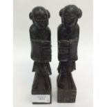A pair of carved soapstone elders.