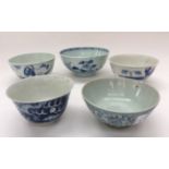 Five Chinese blue and white bowls of various designs,