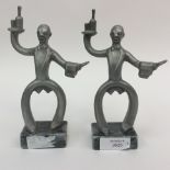 A pair of Art Deco aluminium bookends, in the form of waiters,