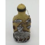 An overlaid glass figural snuff bottle,