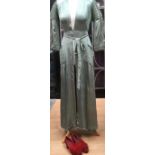 A 1930s silk green gown and a pair of red shoes with Ostrich feathers (size 3).