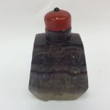 An amethyst carved snuff bottle