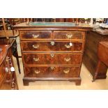 An early 18th Century laburnum and walnut veneered chest of drawers,