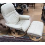 A Stressless cream leather reclining easy chair with matching footstool,