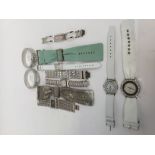 A collection of eleven Oasis ladies fashion watches, white metal and leather strap versions,