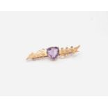 A Victorian amethyst single stone set 9ct gold Etruscan style brooch