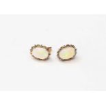 An opal and gilt metal pair of earrings, probably Etheopian opals, oval, approx 9mm x 13mm,