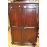 A George III oak hanging corner cupboard,