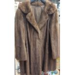 A honey coloured 3/4 mink jacket,