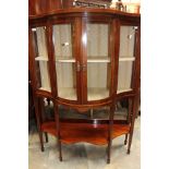 An Edwardian mahogany bow fronted glazed display cabinet