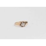 A solitaire ring set with a white stone in 18ct gold, claw setting, size L,