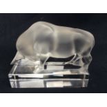 A Lalique frosted glass figure of a charging bull, etched mark 'Lalique, France',