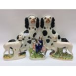 A pair of black and white Stafford Spaniel dogs,