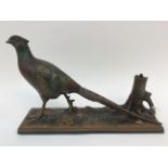 A novelty cold painted pheasant table lighter