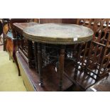 A 19th Century brass topped folding table.