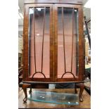 A 1920's Art Deco walnut veneered display cabinet